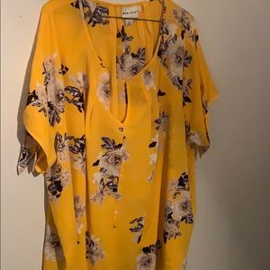 Yellow floral shirt.